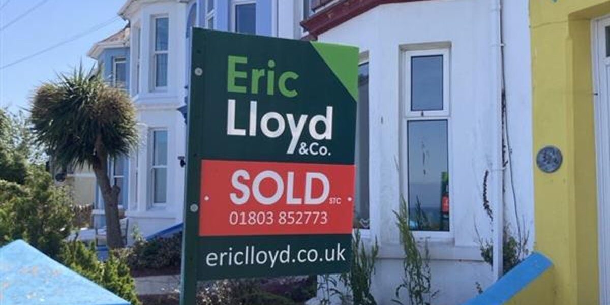 House with SOLD sign representing relocation allowance benefits for associate dentists moving home via their limited company, tax-free