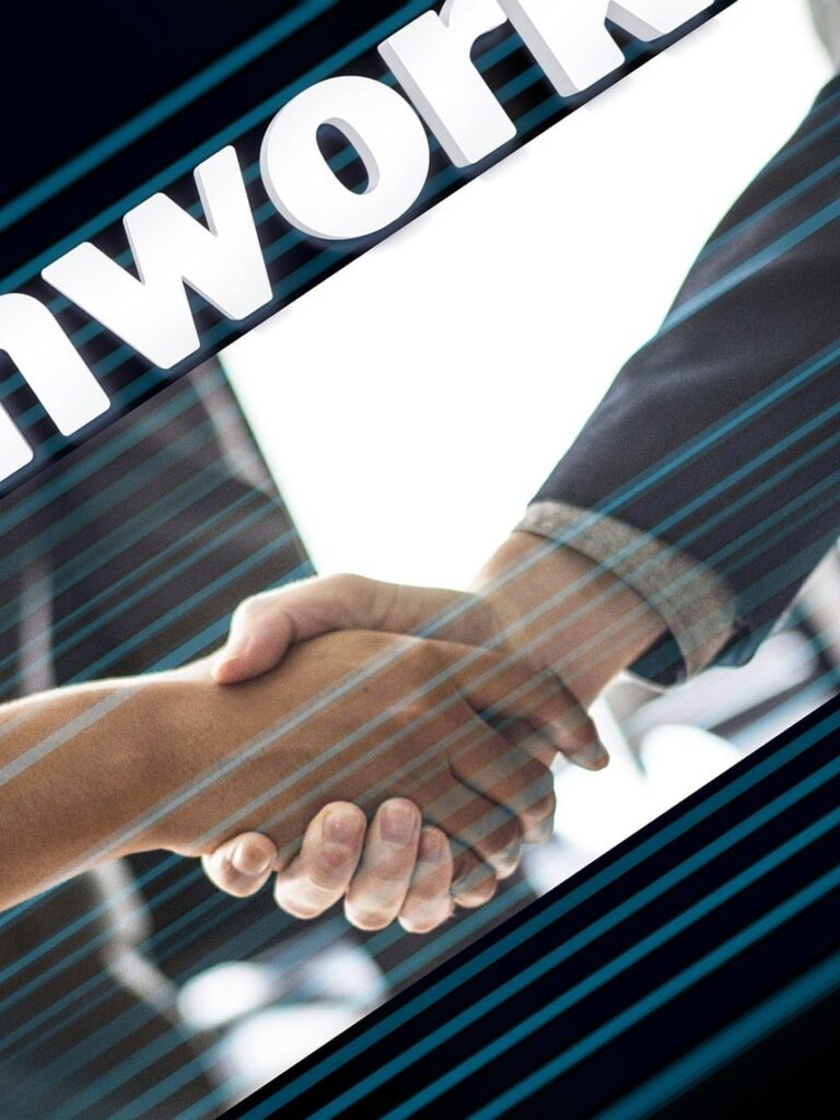 Business handshake representing a tax liability insurance dental practice sale